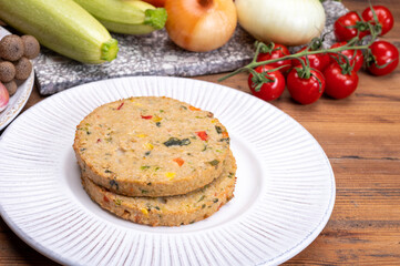 Round vegetarian patties or burgers made from grains, vegetables and legumes