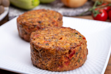 Round vegetarian patties or burgers made from grains, vegetables and legumes