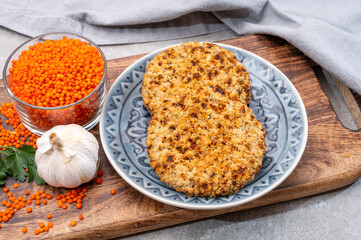 Healthy vegetarian or vegan food, meat free burger made from orange lentils legumes