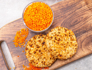 Healthy vegetarian or vegan food, meat free burger made from orange lentils legumes