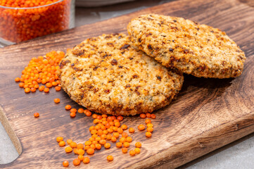 Healthy vegetarian or vegan food, meat free burger made from orange lentils legumes