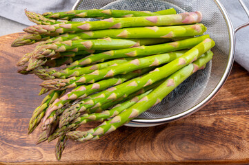 Bunch of fresh ripe green asparagus vegetables ready to cook or grill