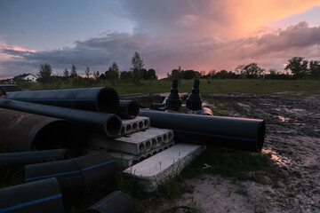 Load steel pipes and fittings at evening