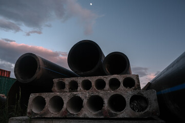 Load steel pipes and fittings at evening