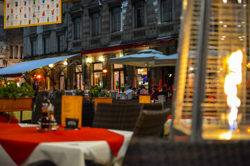 A patio at an outdoor cafe is heated by a flame heater late at night in the Diocletian's Palace...