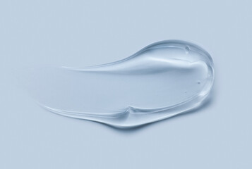 Cream gel gray blue transparent cosmetic sample texture with bubbles blue background