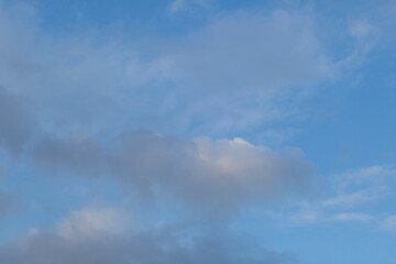 Fototapeta na wymiar Blue sky background with beautiful summer clouds.