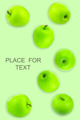 Creative layout with green apples on a light background. Food concept. Copy spaсe