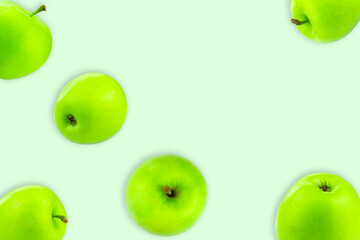 Creative layout with green apples on a light background. Food concept. Copy spaсe