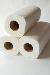 rolls of paper towels, napkins on a white background. White on white, pulp, paper, hygiene. The concept of conscious consumption, sustainable lifestyle. High quality photo