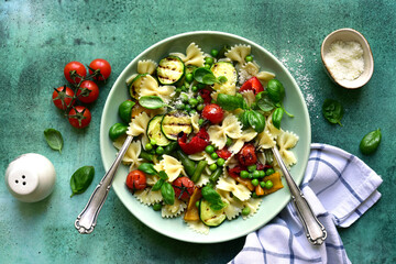 Pasta primavera - traditional italian dish. Top view with copy space.