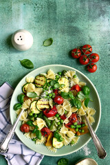 Pasta primavera - traditional italian dish. Top view with copy space.