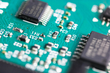 A green electronic circuit board flatly. Top view of pcb board circuit close-up. Radio amateur...