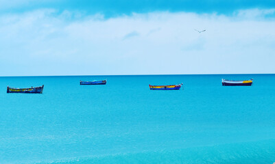 Fototapeta na wymiar colourful boats on the silent sea