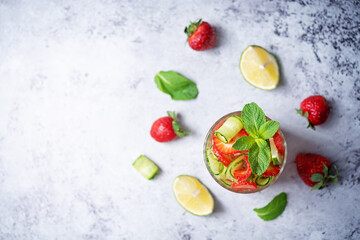 Strawberry lime cucumber mint fresh cocktail in a glass
