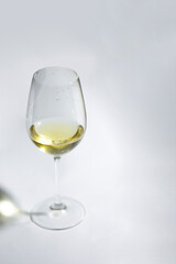 Light wine on white background. Glass with alcohol mockup for posters and product promo.