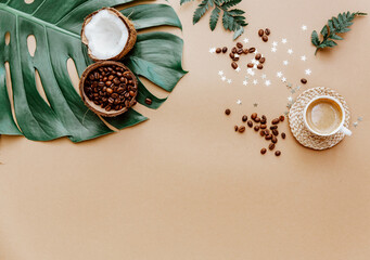 Fototapeta na wymiar Stylish blogger background for social media with coffee cup on brown. Coconut and coffee beans, natural products, zero waste. Flat lay, copy space