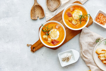 Tomato soup or gazpacho on white background. Summer cold vegan food.