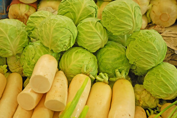 China, Nanjing, cabbage and radish  at the Fuzimiao market. - 429882573