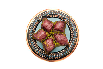 Closeup of traditional Turkish dessert - baklava (violet baklava) isolated on white background. Most popular dessert in Ramadan time (Turkish: Ramazan bayrami).