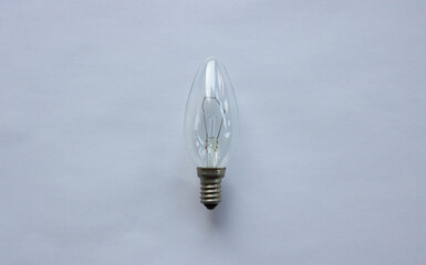 Small tungsten light bulb isolated on white background