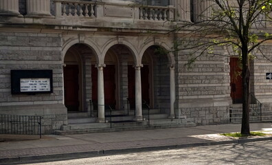 Fototapeta premium Church Entry Way with Three Arched Doors in Daylight