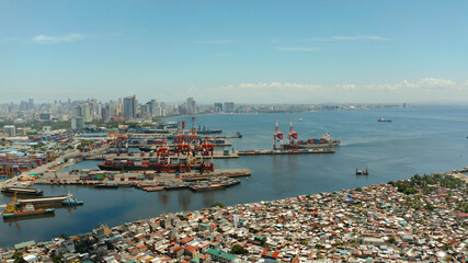Cityscape of the capital of the Philippines Manila with the port and business centers, skyscrapers....