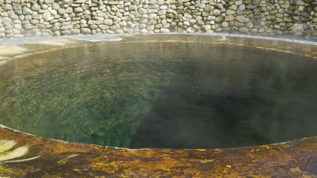 Famous natural hot spring well in Raksa Warin public park, Ranong, Thailand.
