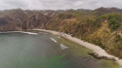 aerial seascape sand beach with turquoise water. Seascape, ocean and beautiful beach. Java Indonesia Travel concept.
