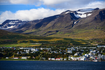 View of Akureyri, the country's second largest city, dwarfed by mountains across the Eyjafjörður...