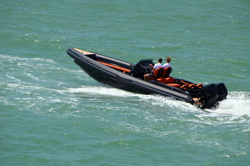 High-end pontoon motor boat powered by two outboard engines .