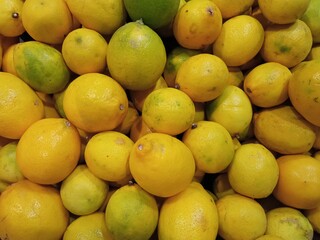Abstract background of stacked fresh yellow lemon