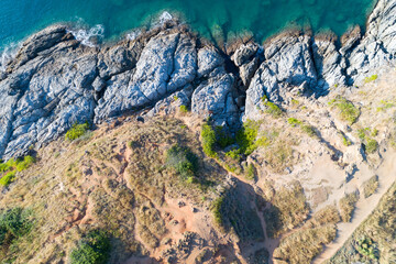 Obraz premium High angle view Tropical sea with wave crashing on seashore and high mountain located in Phuket Thailand aerial view drone top down Amazing nature Top view Seascape
