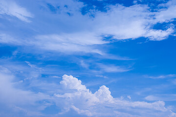 Naklejka na ściany i meble Blue sky background with white clouds floating.