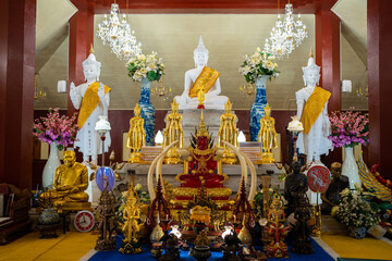 Many Buddha statues were laid together to allow the general public to worship,Vintage statue old Buddha on shelf in Buddhism' s house,Buddha shelf
