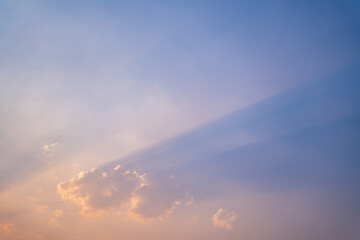 Twilight sky background,Colorful Sunset sky and cloud, vivid sky in twilight time background, Fiery orange sunset sky. Beautiful, Beautiful Cloudscape Landscape, Sunset with sun rays, light rays.