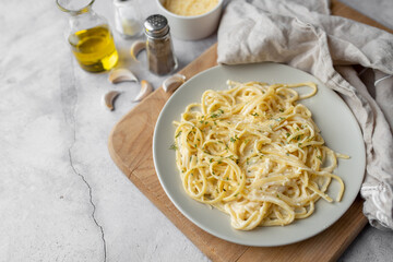 Alfredo pasta dinner with creamy white sauce with herbs seasoning. Pasta made in Italian restaurant called Alfredo. Cheese Alfredo Pasta.