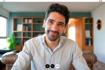 Business man on a work video call from home.