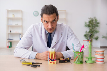 Young male doctor stomatologist working in the clinic