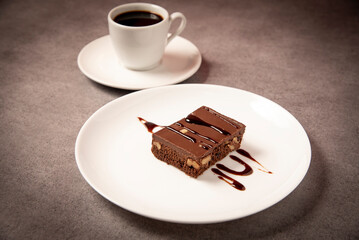 brownie covered with chocolate on a table