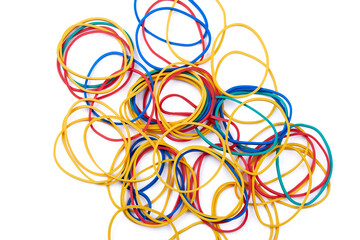 Large set of multi-colored rubber bands photographed on a white background