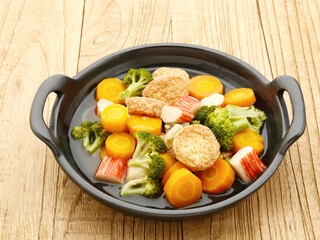 Sapo tahu, chinese food made with tofu, vegetables and seafood. Served on black plate. Selective focus.