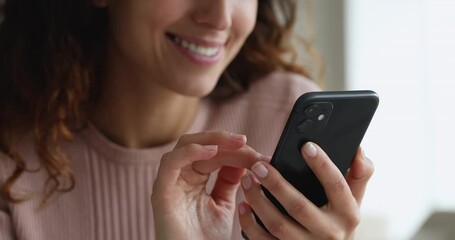 Close up female hands holding smartphone using mobile application, e-commerce client, e-shopping and user of electronic commercial retail services. Modern technology usage for fun, work, hobby concept - Powered by Adobe