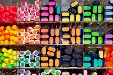 Colorful magic pens or highlighted pens sold on shelves in accessory shop. Colorful background and wallpaper.