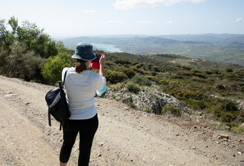 Hiking and taking a photo in the mountains in Spain 