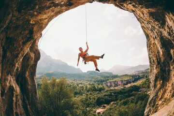 Rock climber hanging on a rope.