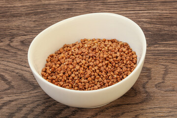 Raw buсkwheat cereal in the bowl