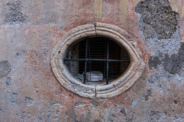 Old vintage window on an ancient facade. No people