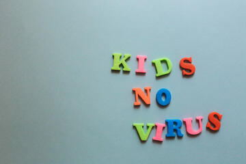 Blue background with plastic magnetic letters, Kids No Virus inscription