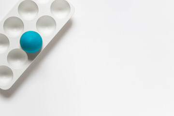 Simple minimalistic Easter greeting card with egg plastic stand hold and one blue egg